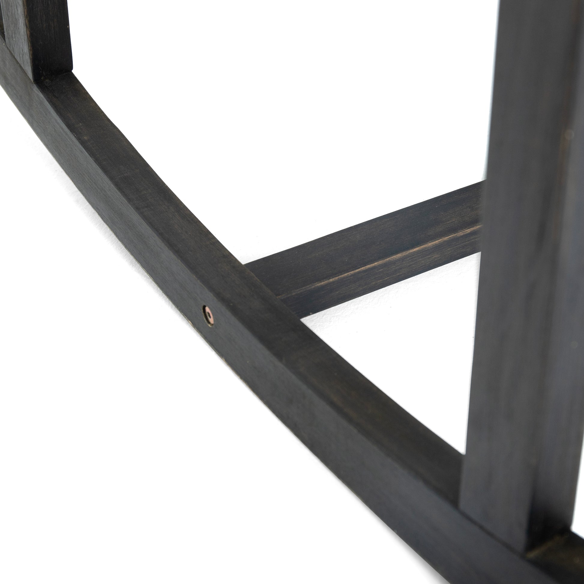 Close up of dark wood furniture frame corner join