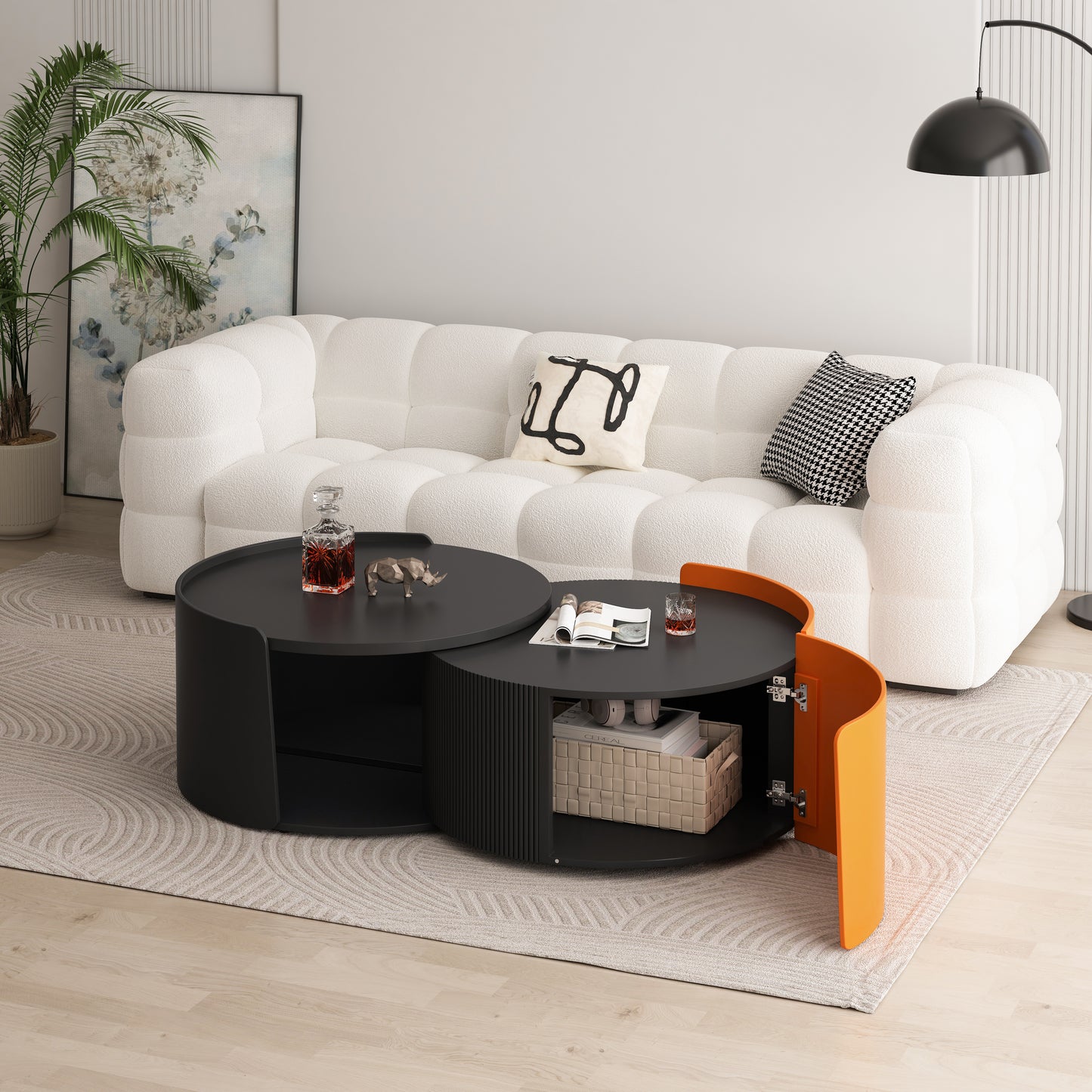 Black nesting coffee table with orange accent cabinet and hidden storage