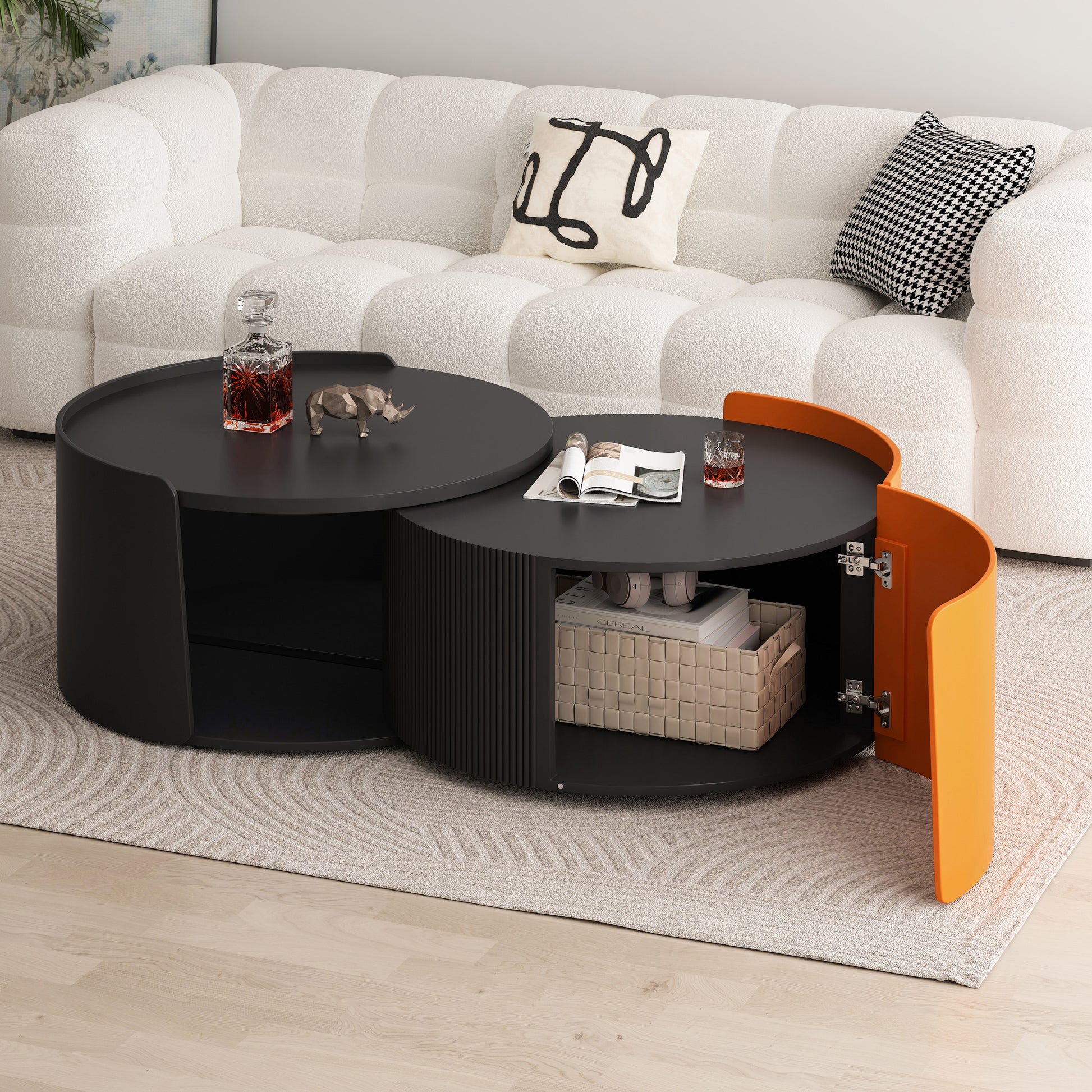 Round nesting coffee table with black finish and an orange accent piece