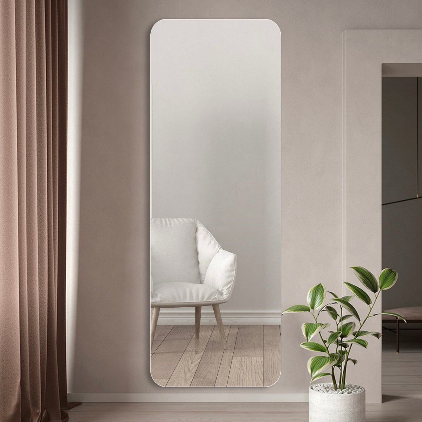 Tall rounded corner floor mirror in a modern living room