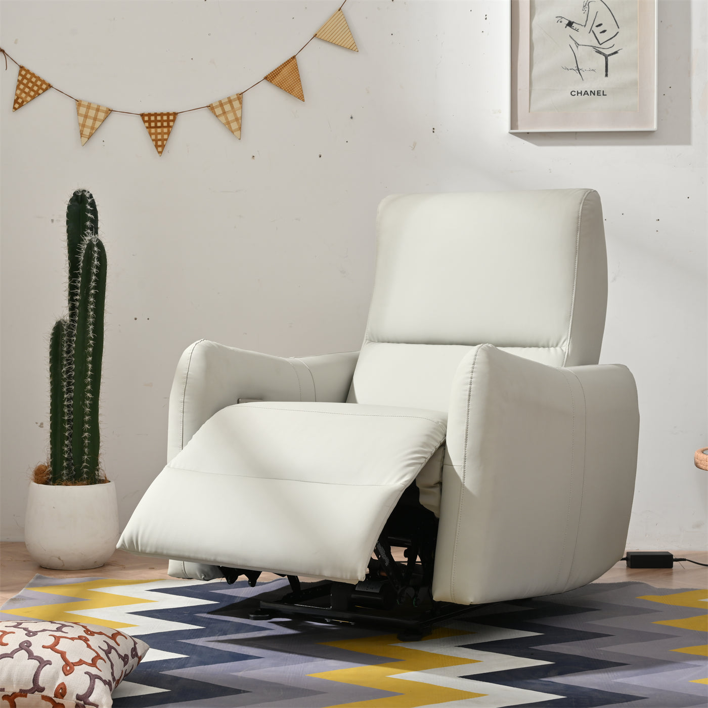 White leather power recliner chair with adjustable footrest and padded headrest