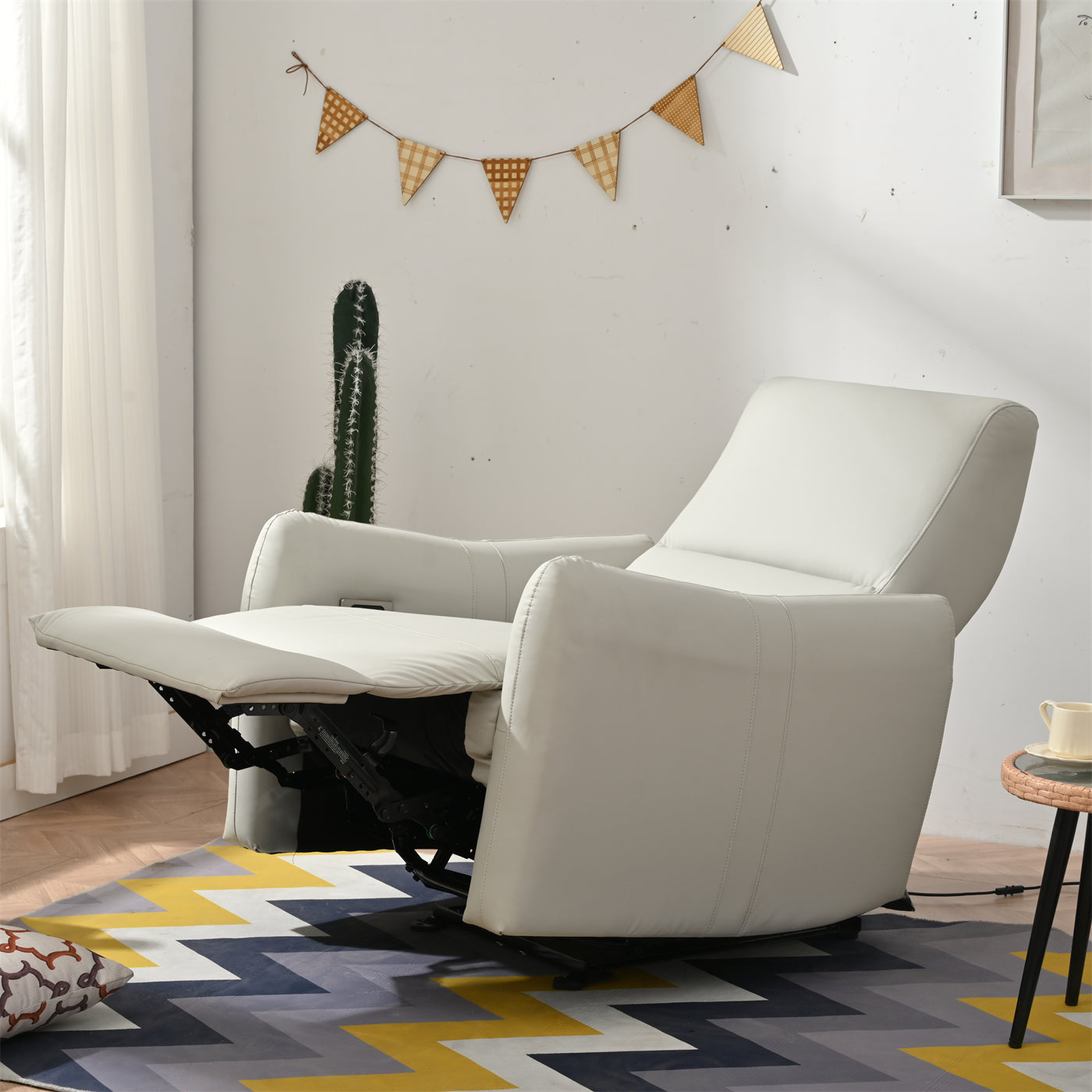 White leather recliner chair with extended footrest