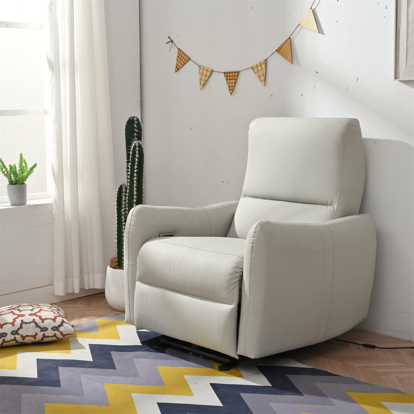 Light gray power recliner with plush cushioning and modern design