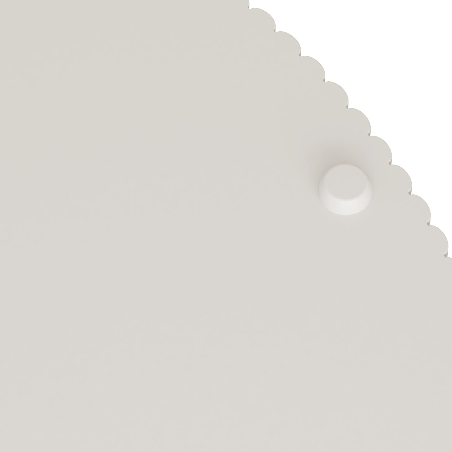 White scallopedged placemat with textured surface