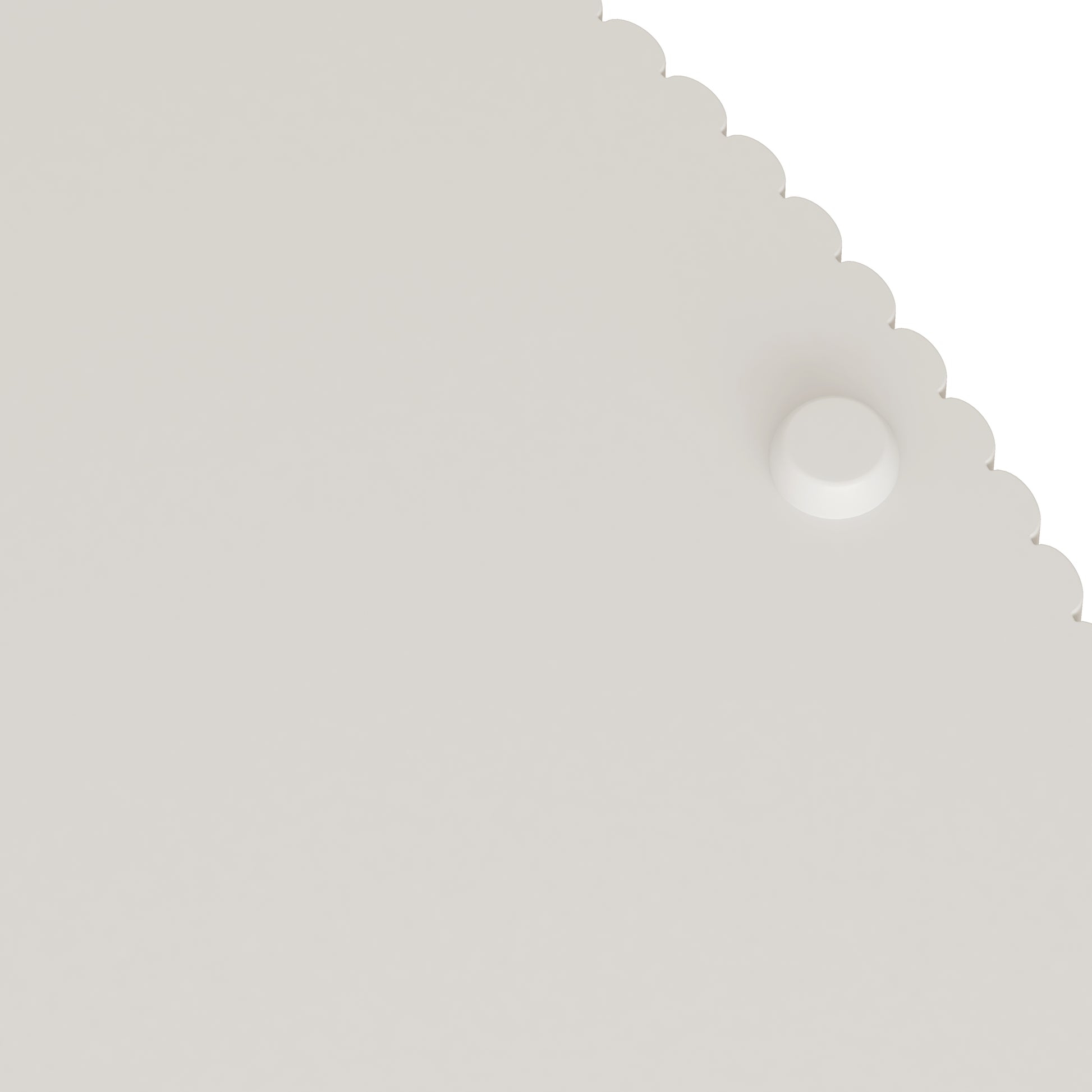 White scallopedged placemat with textured surface