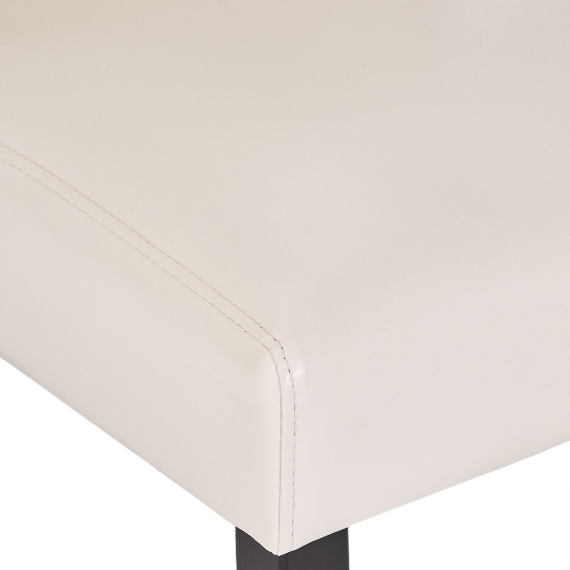Cream upholstered dining chair with subtle stitching detail