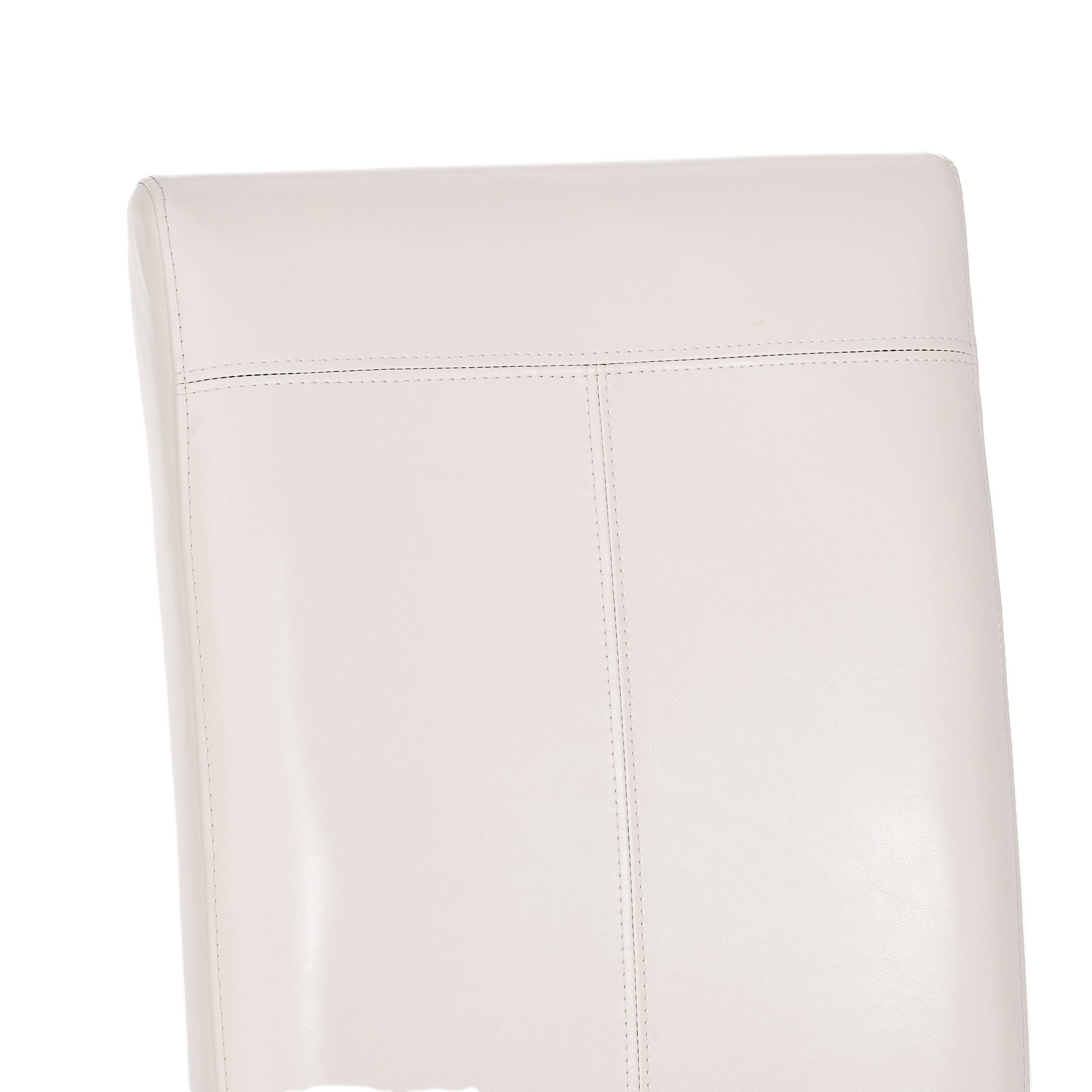 Closeup of a plush white leather dining chair back with subtle stitching