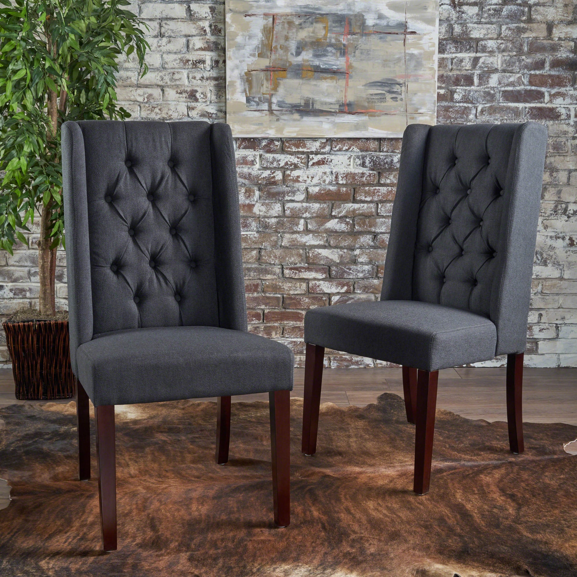 Dark gray upholstered dining chair with tufted back and mahogany legs