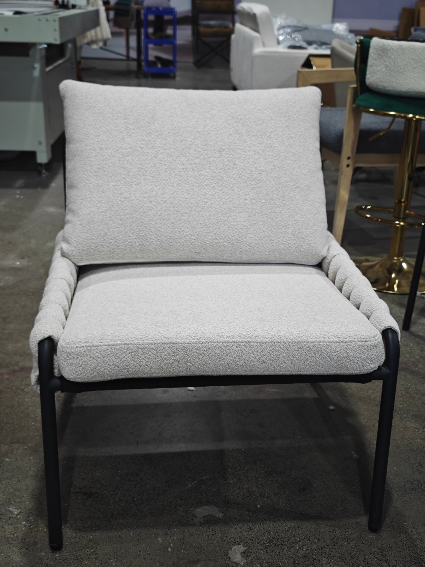 Cream boucle armchair with black metal legs
