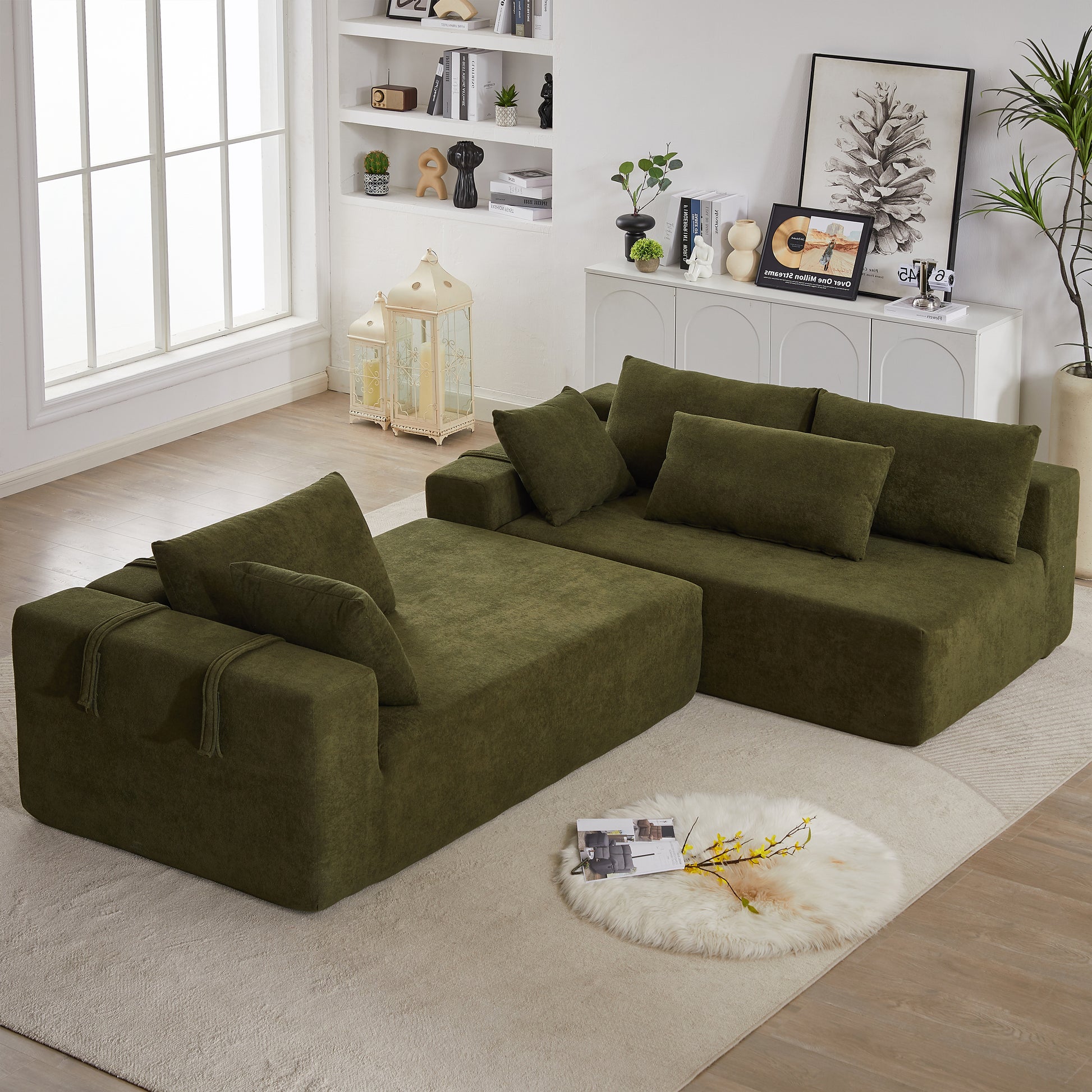 Plush green sectional sofa with matching throw pillows perfect for a modern living room