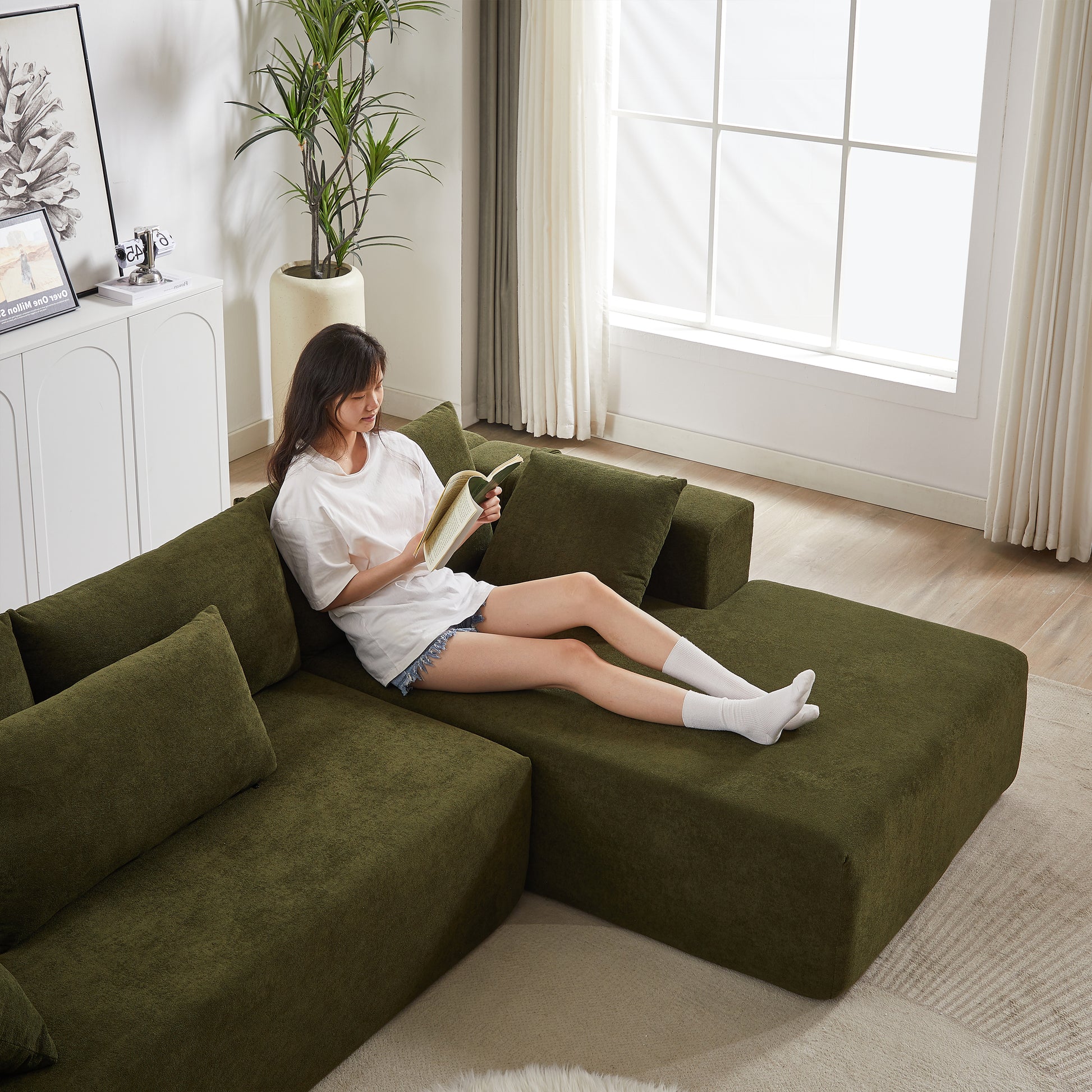 Sectional green sofa with textured fabric