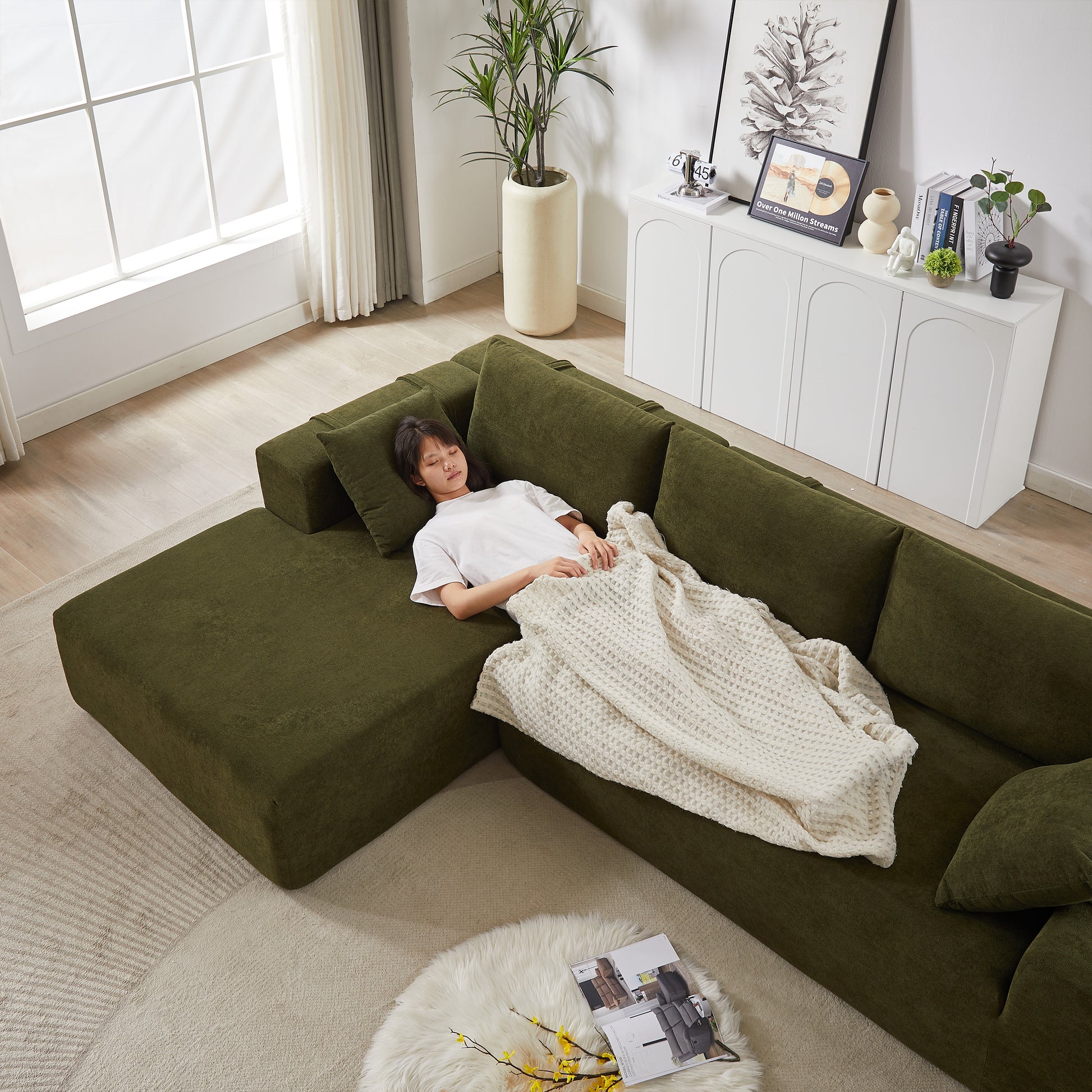 Deep green modular sofa with plush fabric ideal for a contemporary living room