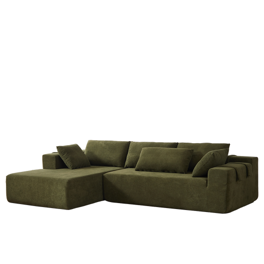 Plush green sectional sofa with modern lowprofile design and multiple throw pillows