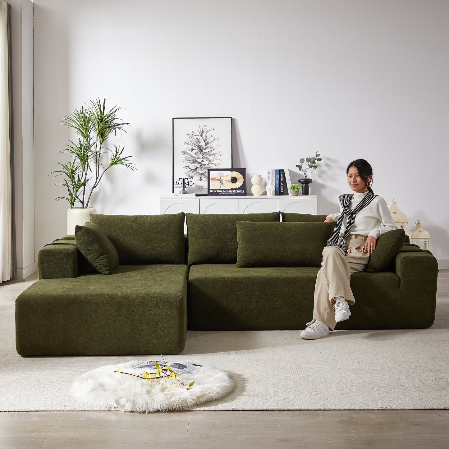 Deep green modular sectional sofa with plush textured fabric perfect for a modern living room setup
