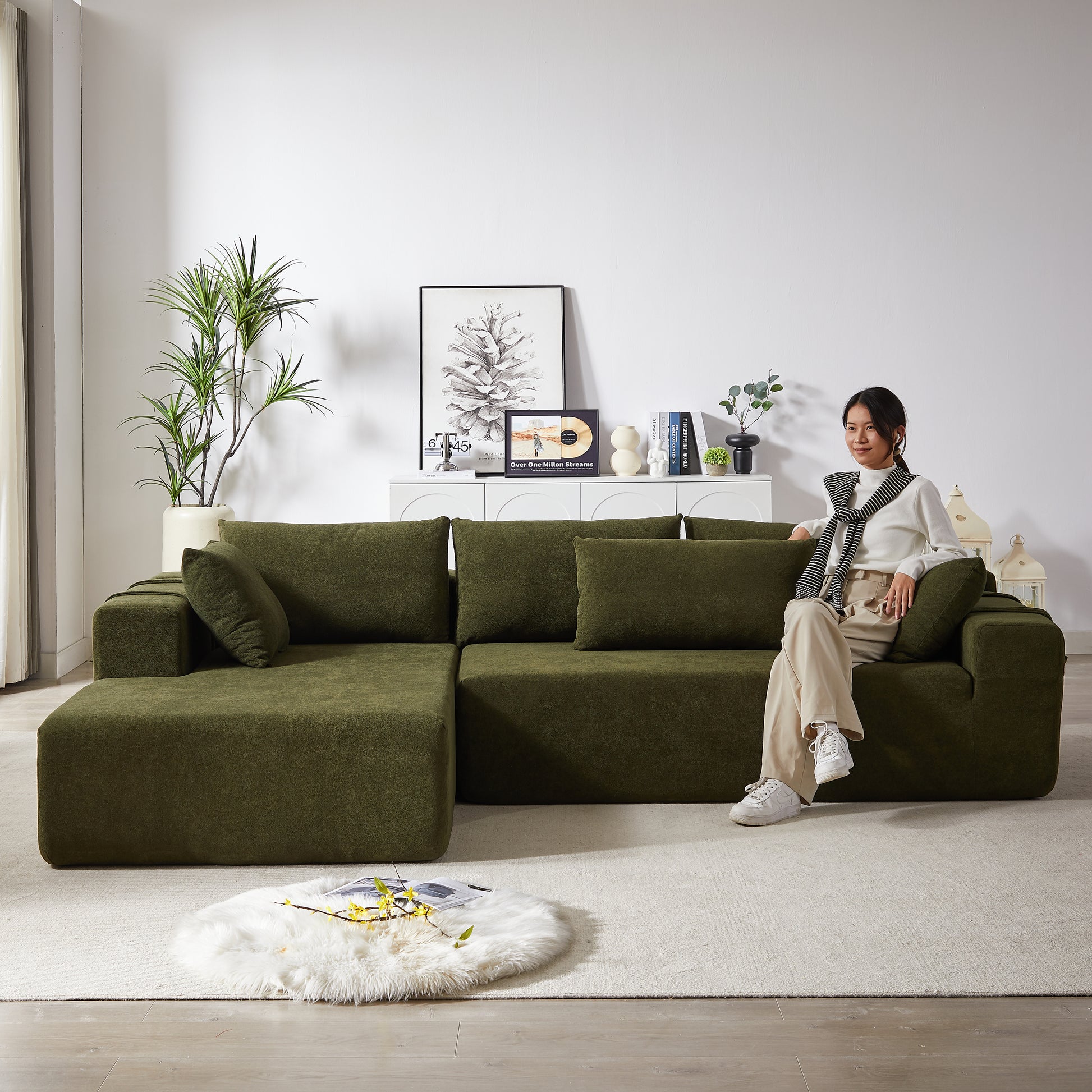 Deep green modular sectional sofa with plush textured fabric perfect for a modern living room setup