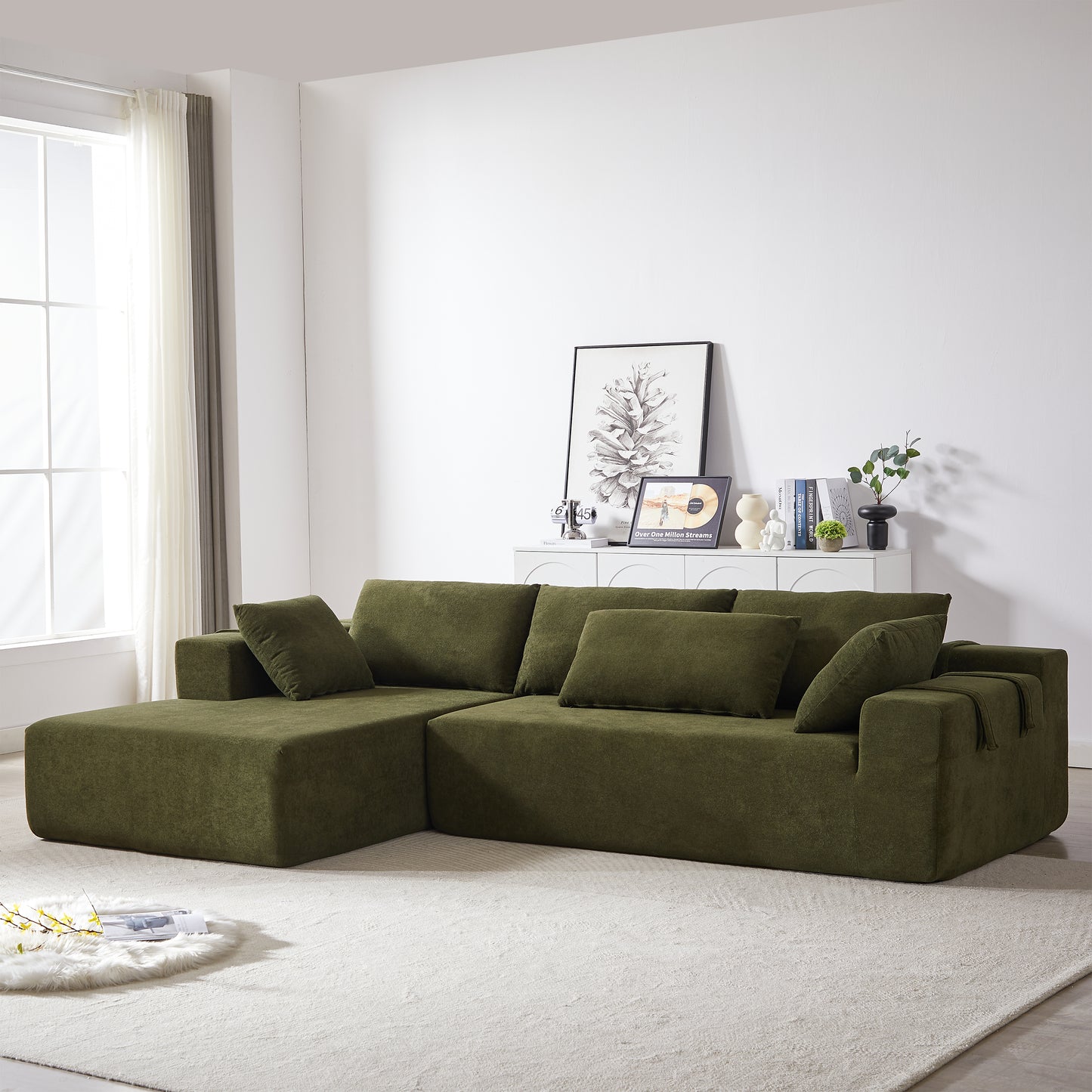 Plush olive green sectional sofa with deep seats and square arms