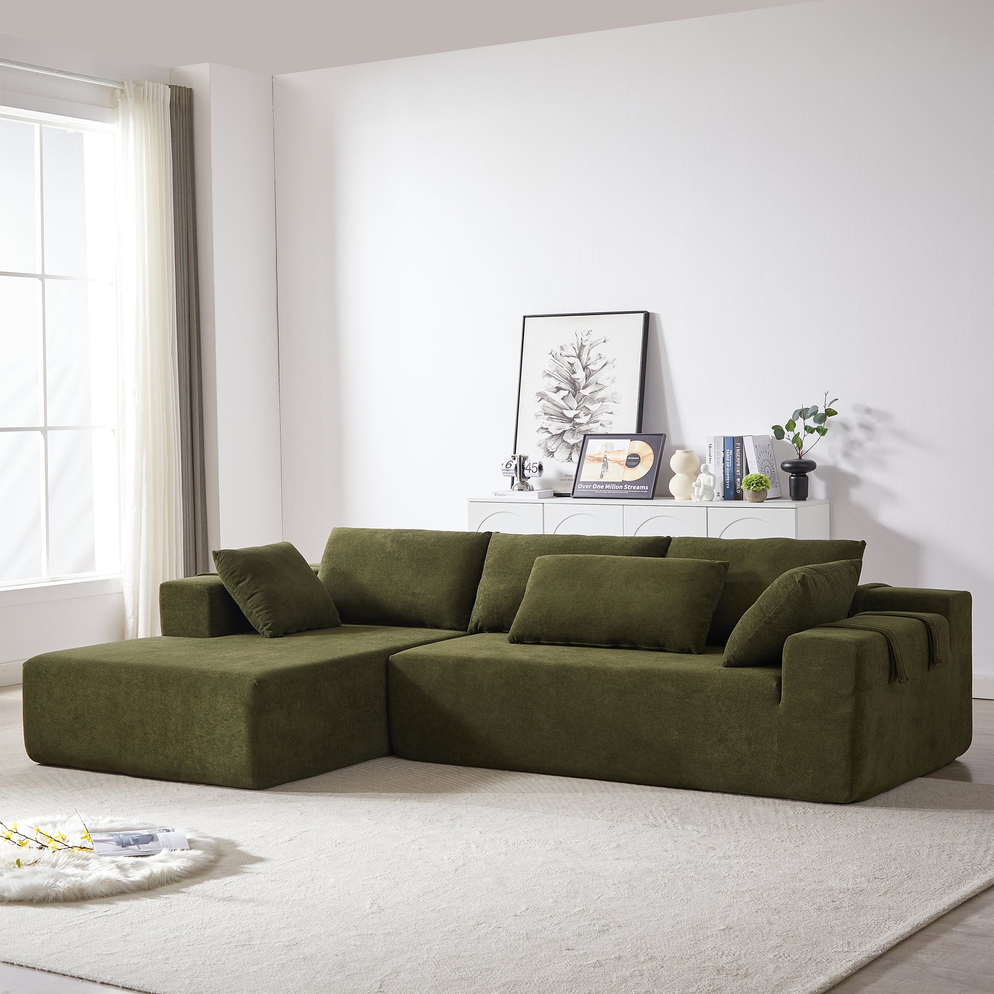 Plush olive green sectional sofa with deep seats and square arms