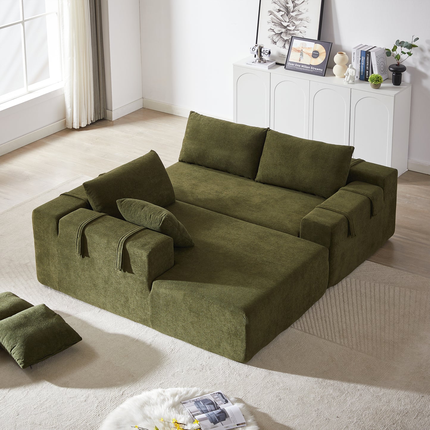 Moss green fabric sectional sofa with chaise lounge and matching pillows
