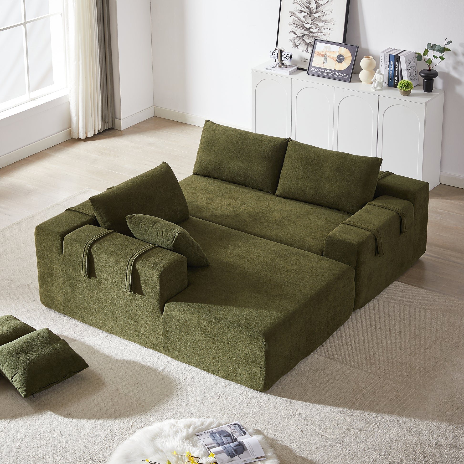 Moss green fabric sectional sofa with chaise lounge and matching pillows