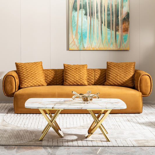 Mustard velvet sofa with textured throw pillows