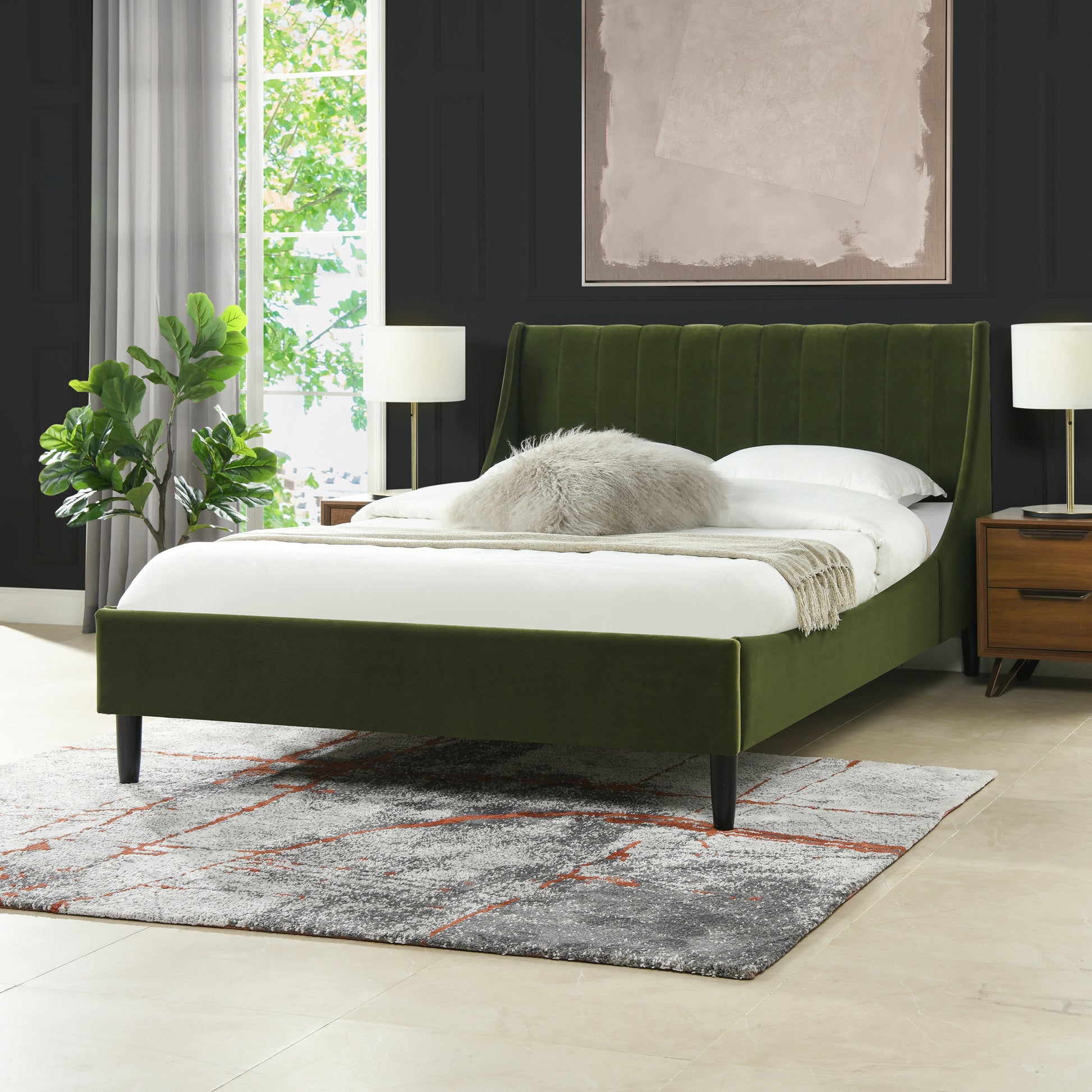 Green velvet wingback queen bed with plush accent pillow