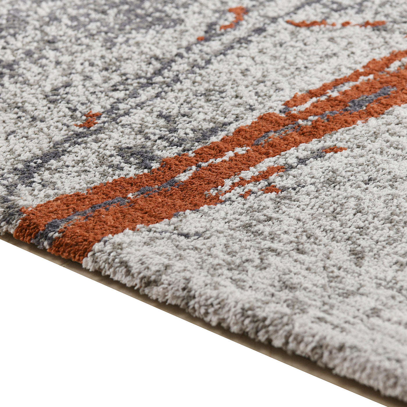 Closeup of a textured gray rug with abstract burnt orange and navy blue stripes