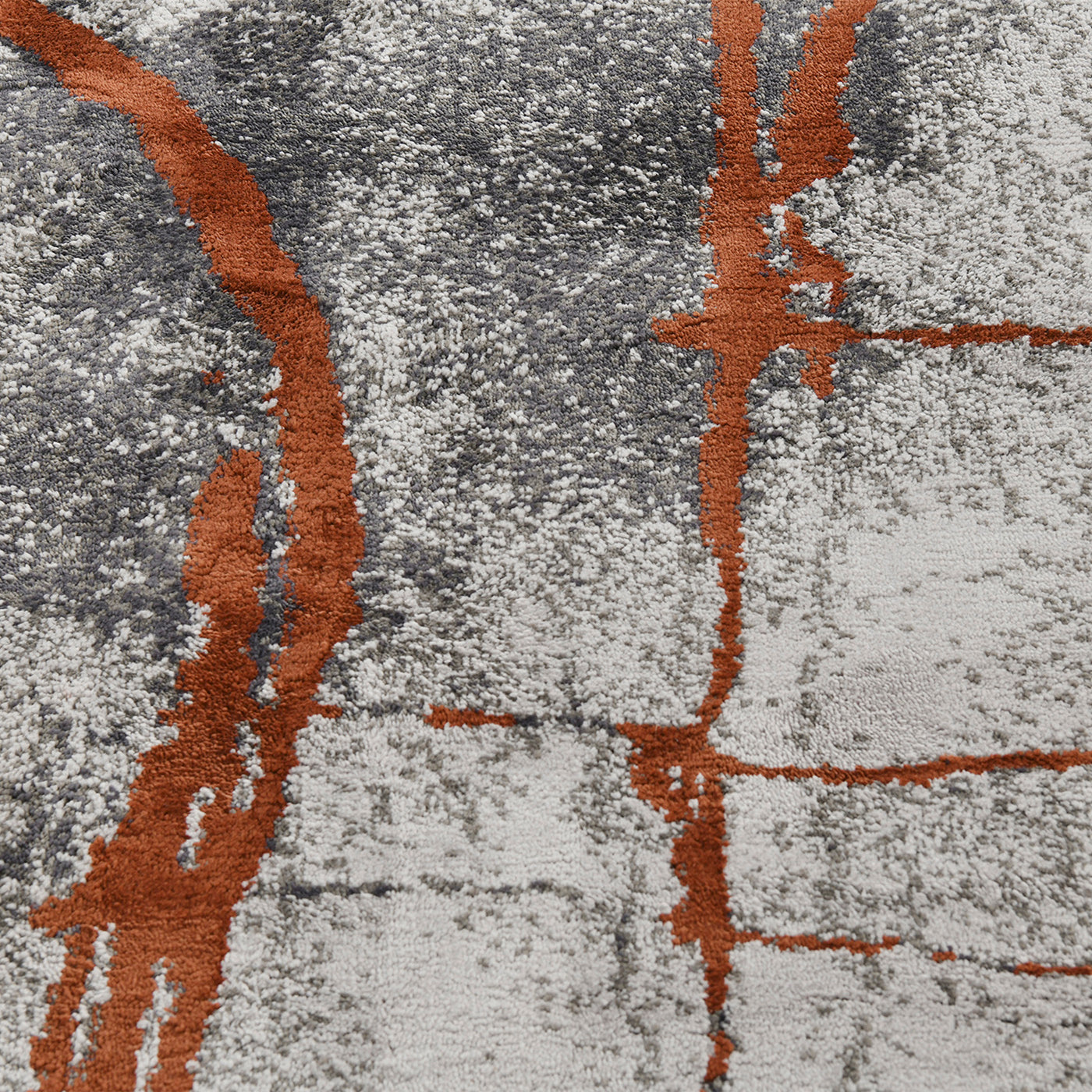 Abstract gray and orange textured rug