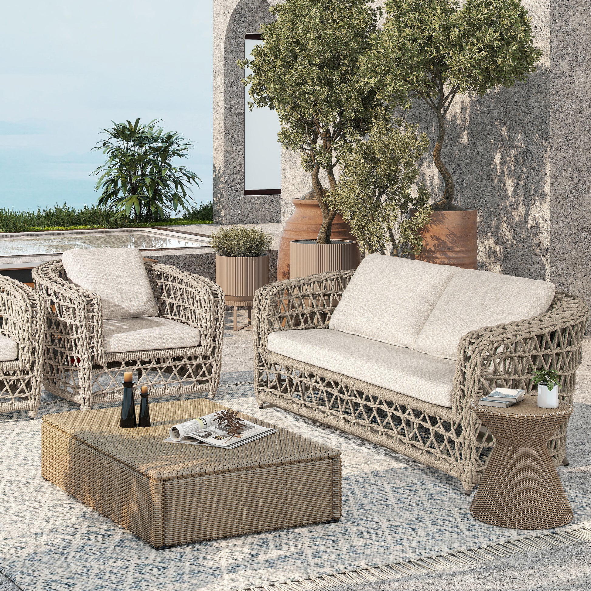 Woven wicker outdoor sofa set with cream cushions and a rectangular coffee table