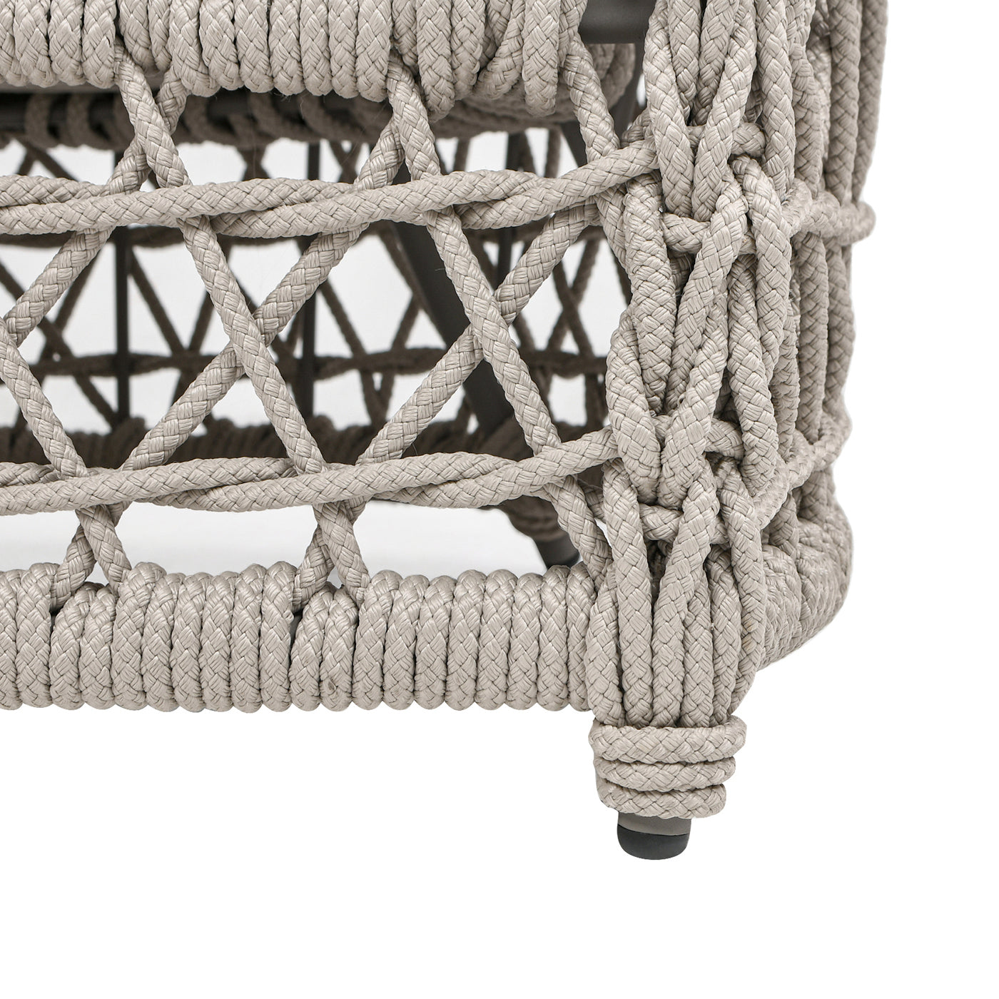 Closeup of grey rope weave on outdoor chair leg detail