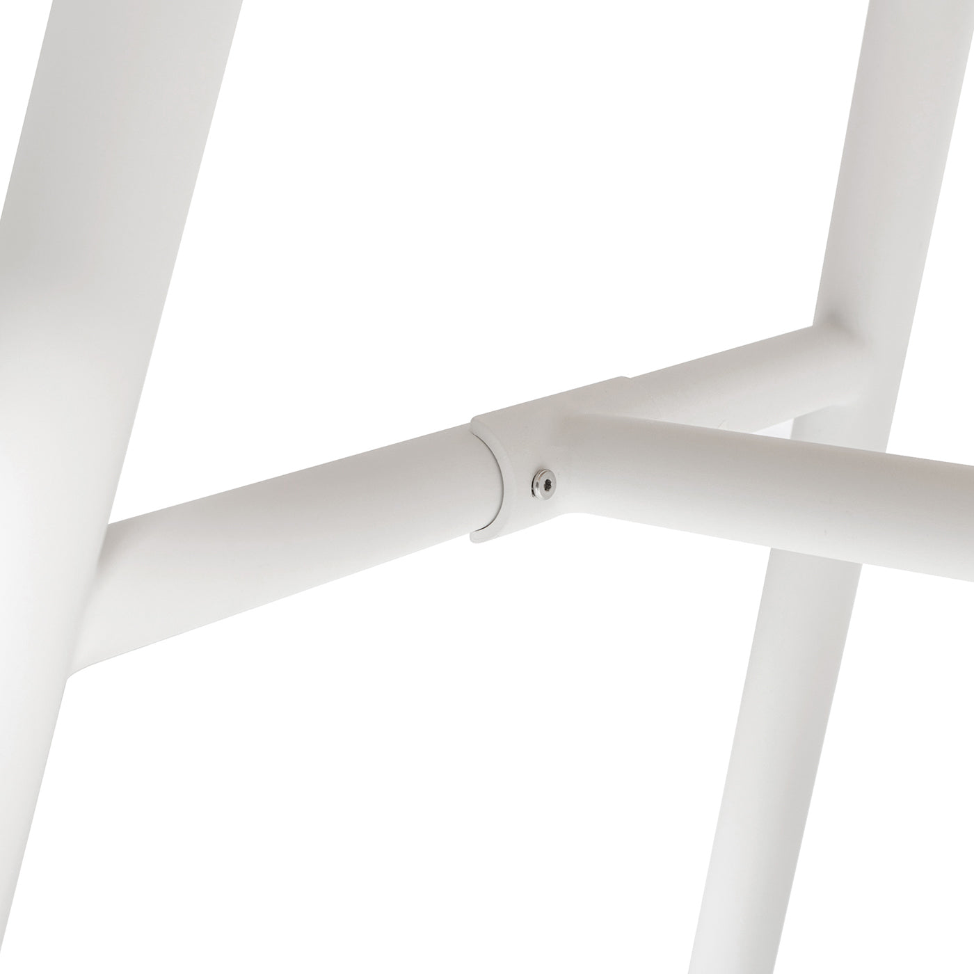 White metal tube joint with screw detail on minimalist furniture leg