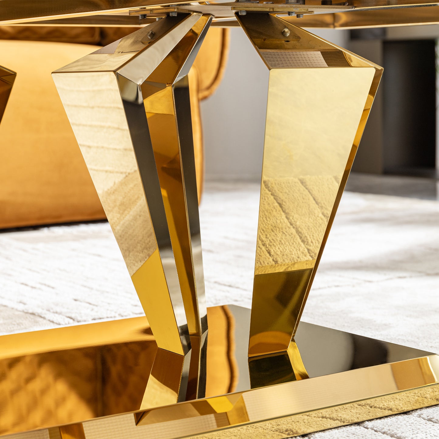 Geometric gold metal table base with faceted legs