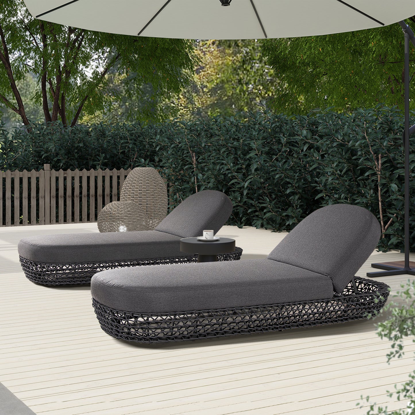 Dark gray outdoor chaise lounge with woven black base