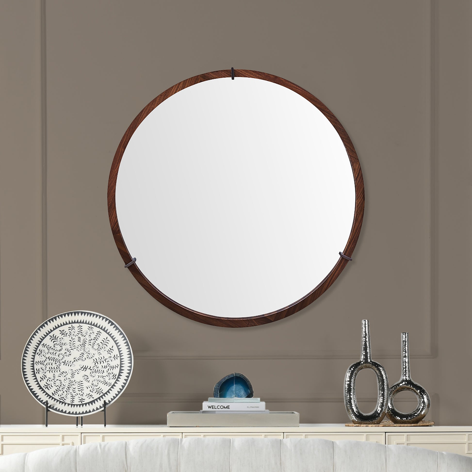Round dark wood framed mirror with minimalist design perfect for entryways