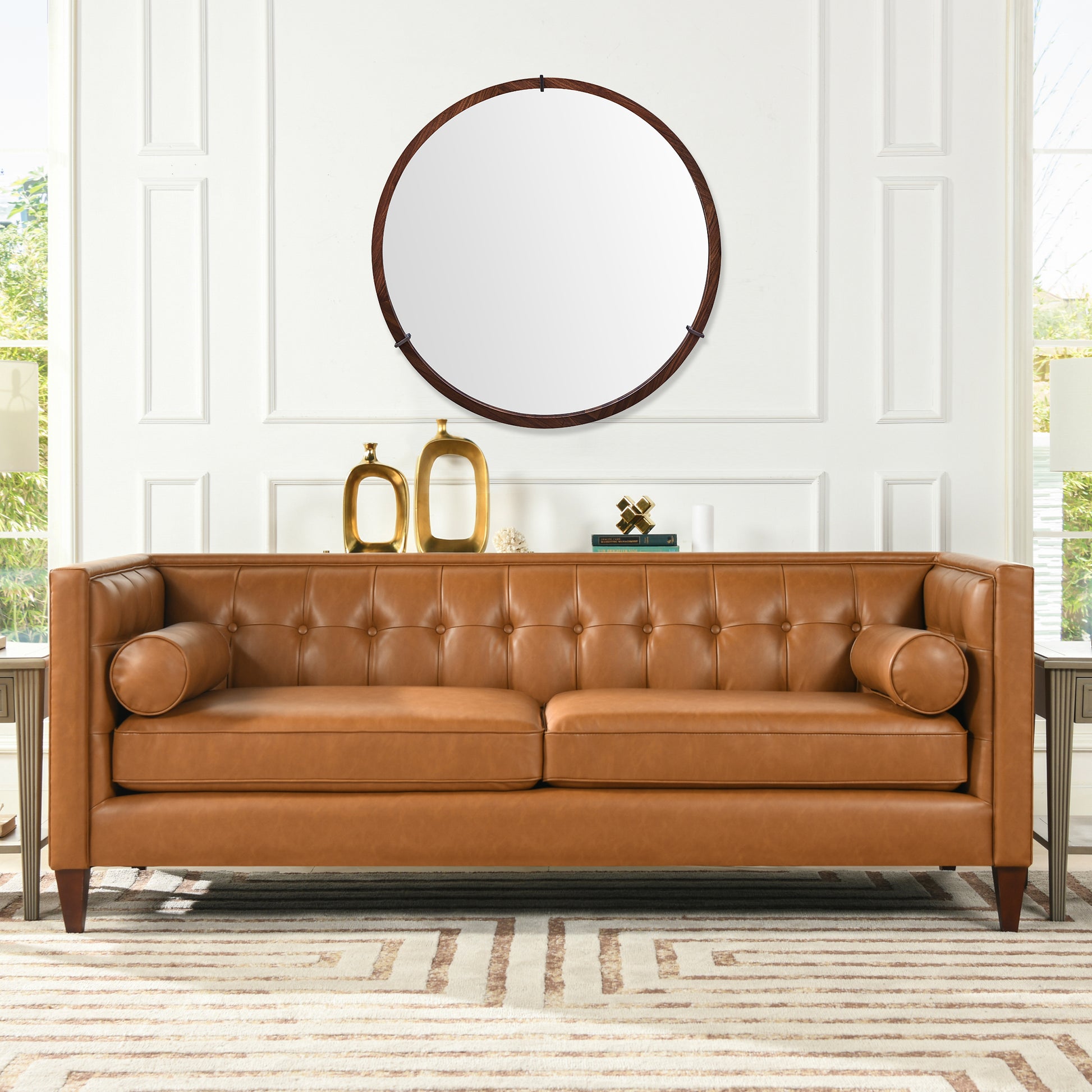 Tufted caramel leather sofa with bolster pillows perfect for a modern living room