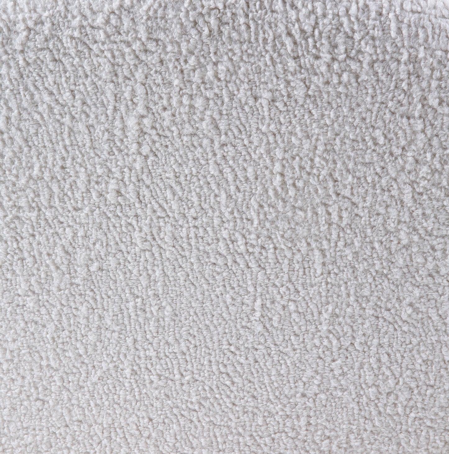 Closeup of a soft white sherpa fabric with a fluffy texture