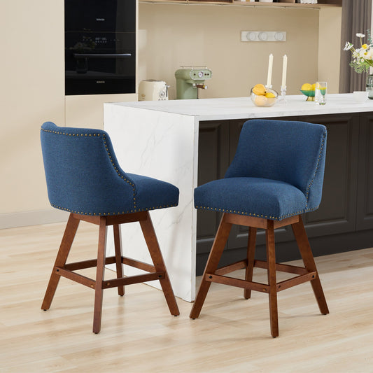 Blue fabric swivel bar stool with bronze nailhead trim and dark wood legs