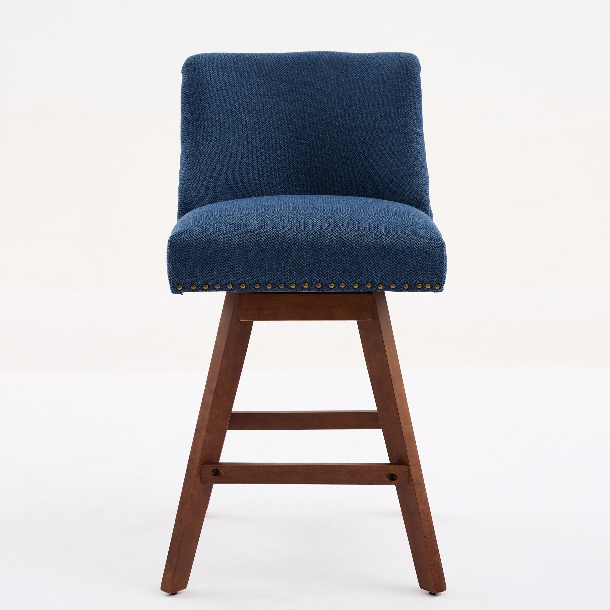Blue upholstered swivel bar stool with wooden legs and brass nailhead trim