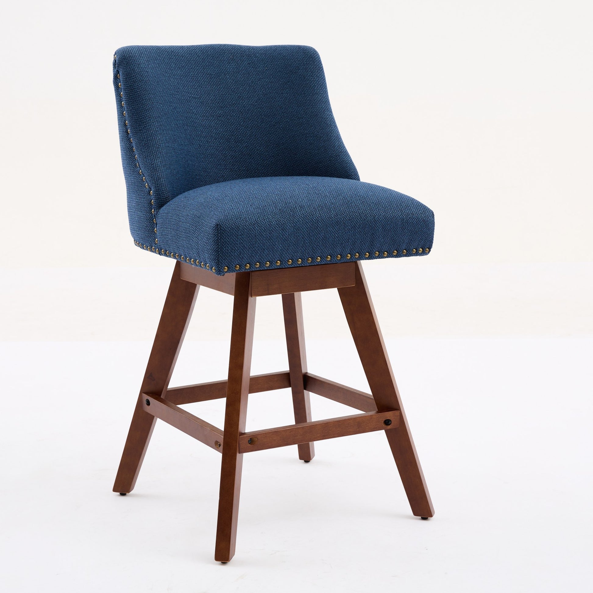 Swivel bar stool with navy blue textured fabric brass nailhead trim and a wooden base