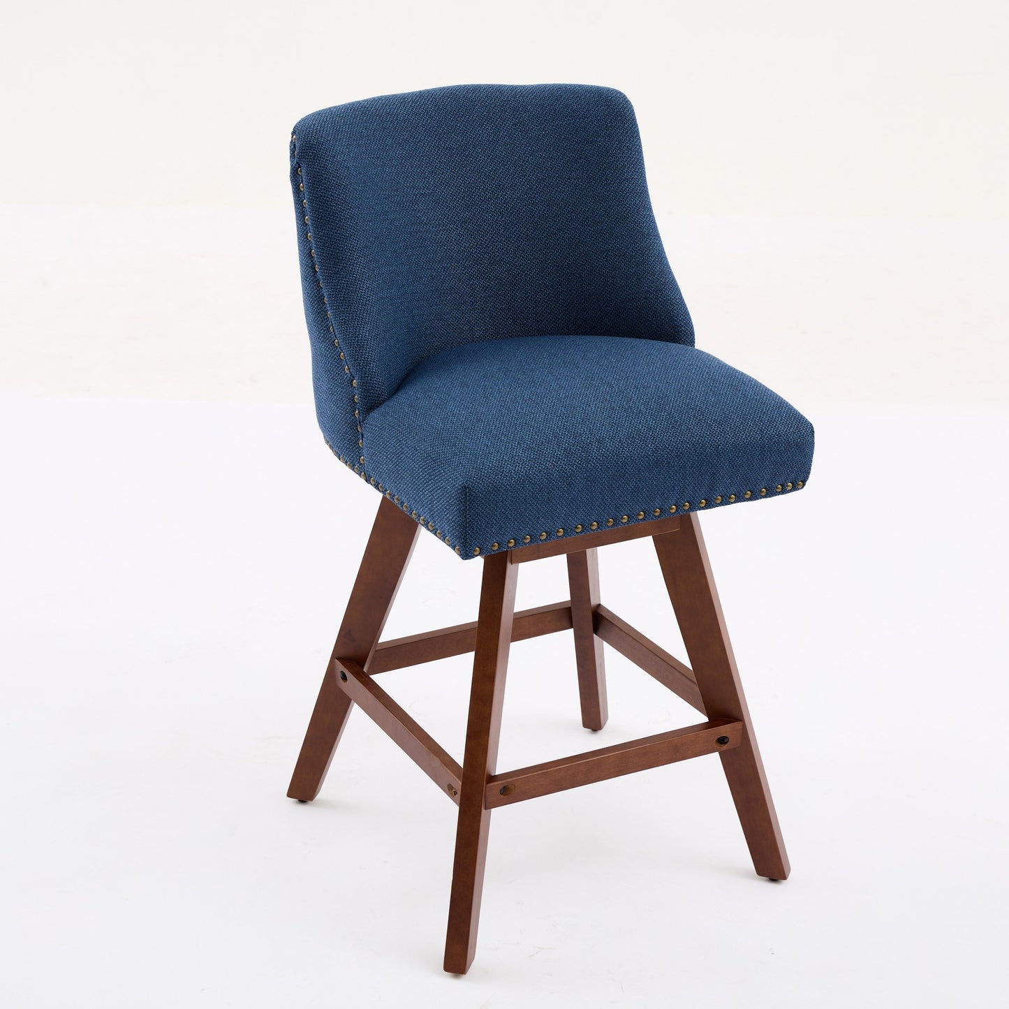 Deep blue fabric swivel bar stool with bronze nailhead trim and dark wood legs