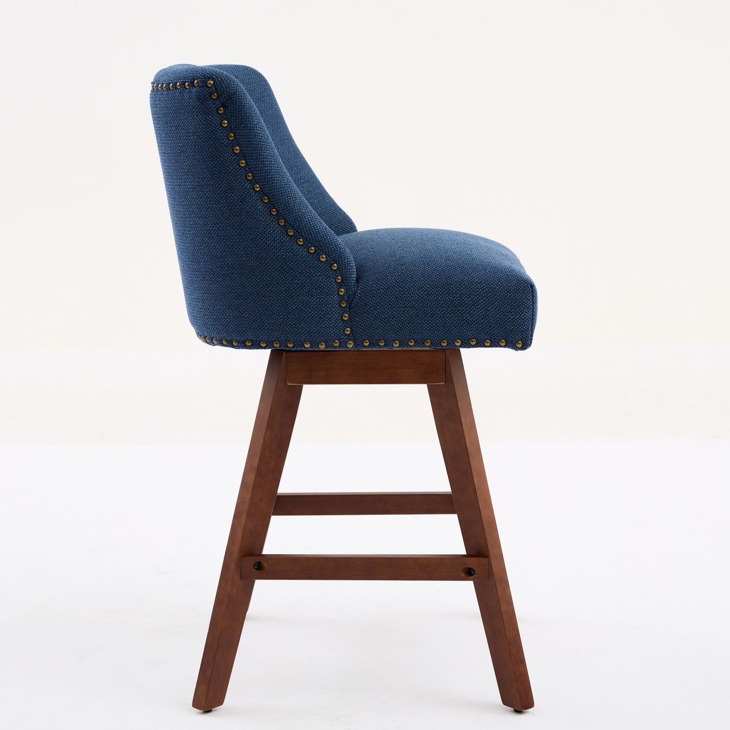 Navy blue upholstered swivel bar stool with wood legs and brass nailhead trim