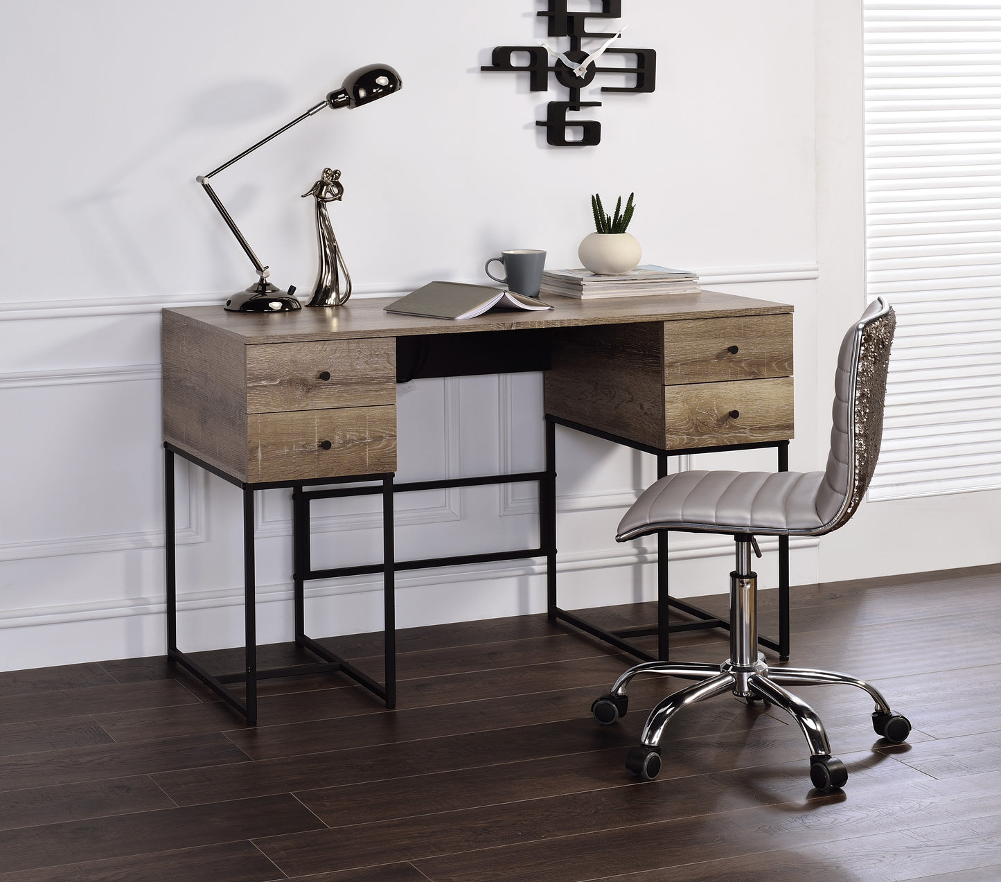 A light oak desk with black metal legs and four drawers for a modern office setup