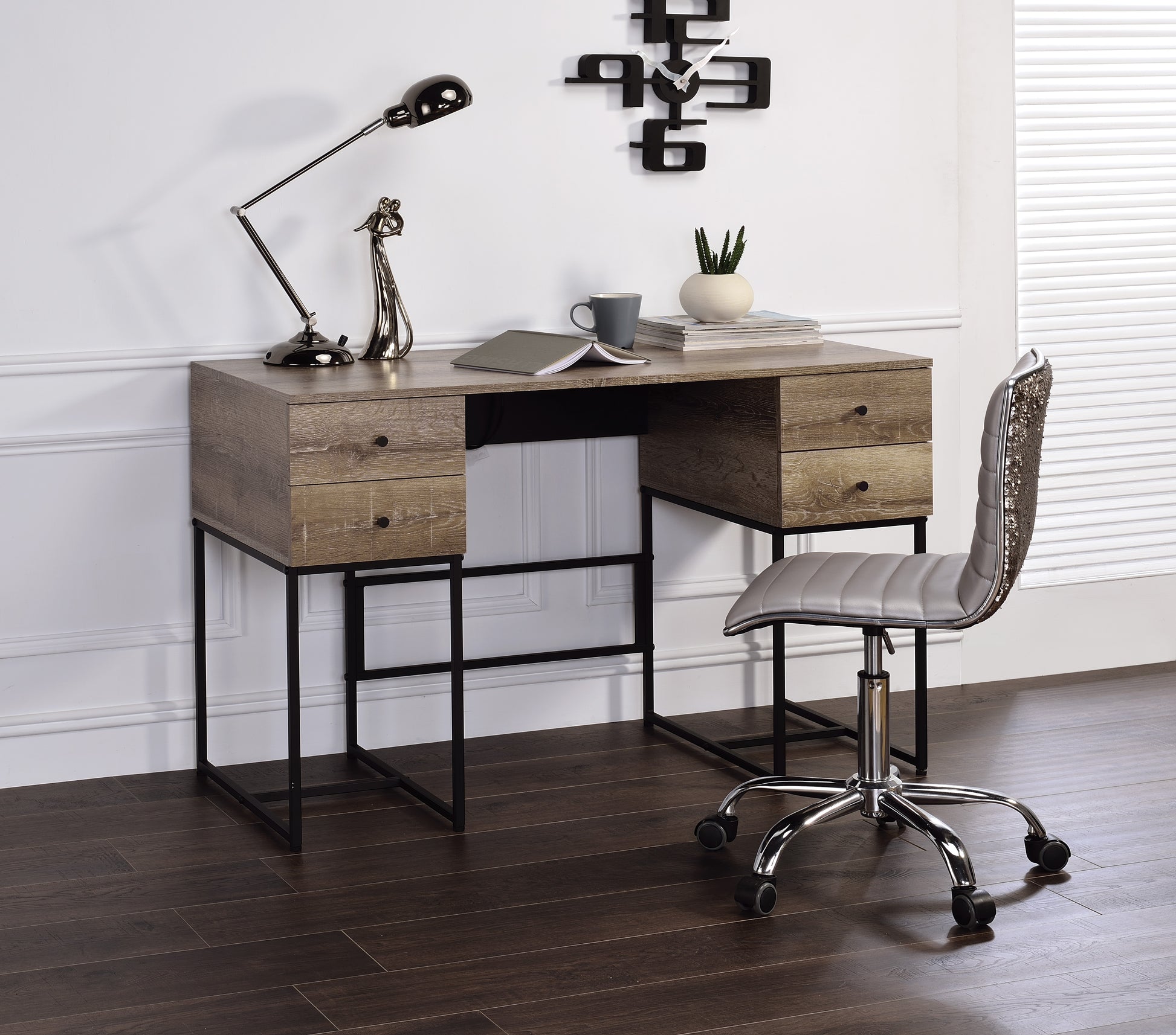 A light oak desk with black metal legs and four drawers for a modern office setup