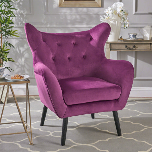 Tufted velvet accent chair in deep purple with black tapered legs