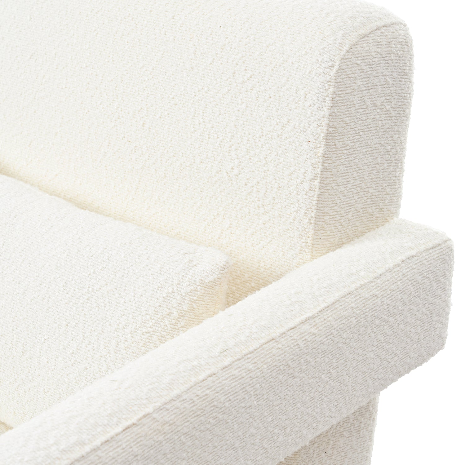 Closeup of a plush creamcolored boucle fabric armchair with a curved backrest
