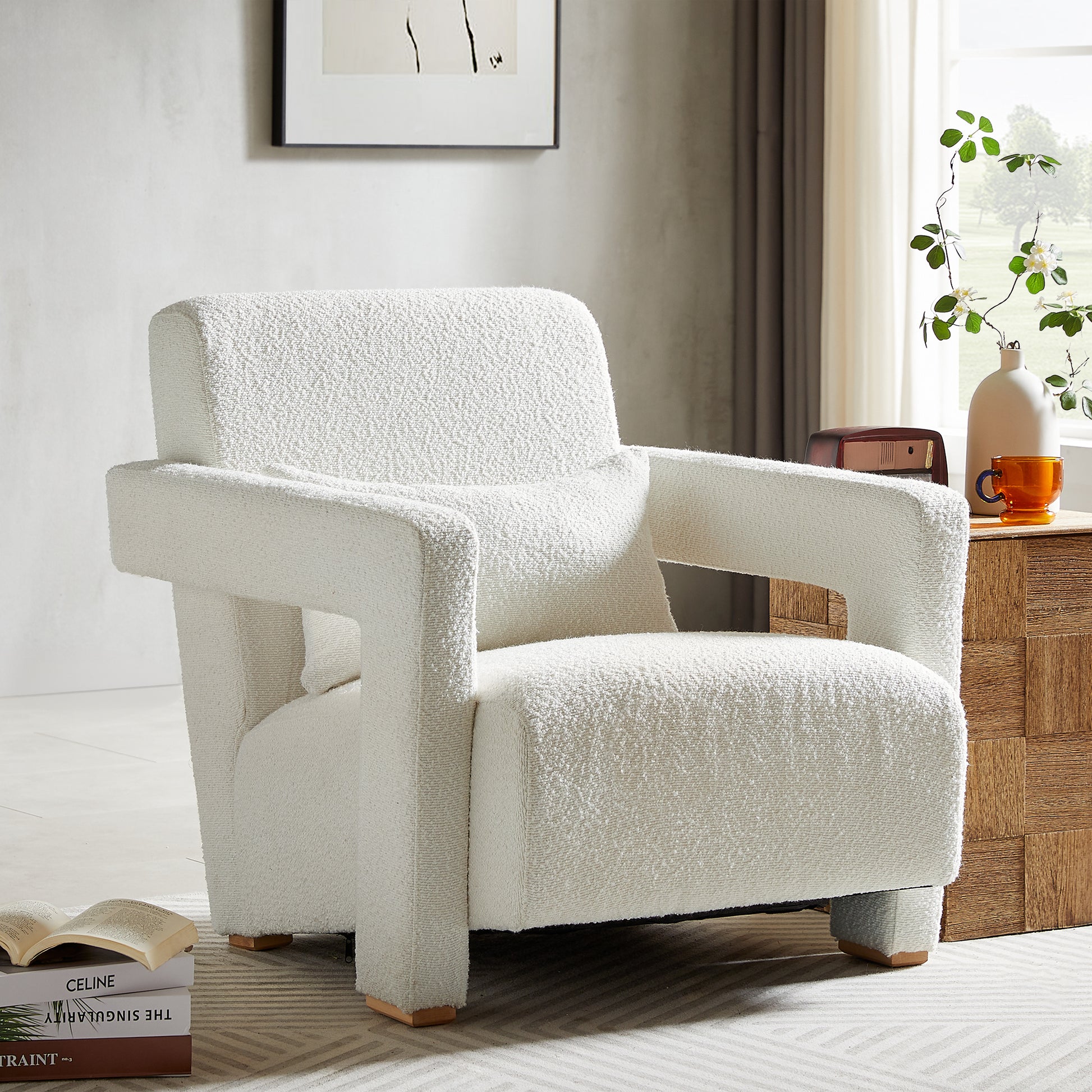 Cozy white boucl armchair with plush seating and modern square arms perfect for living rooms