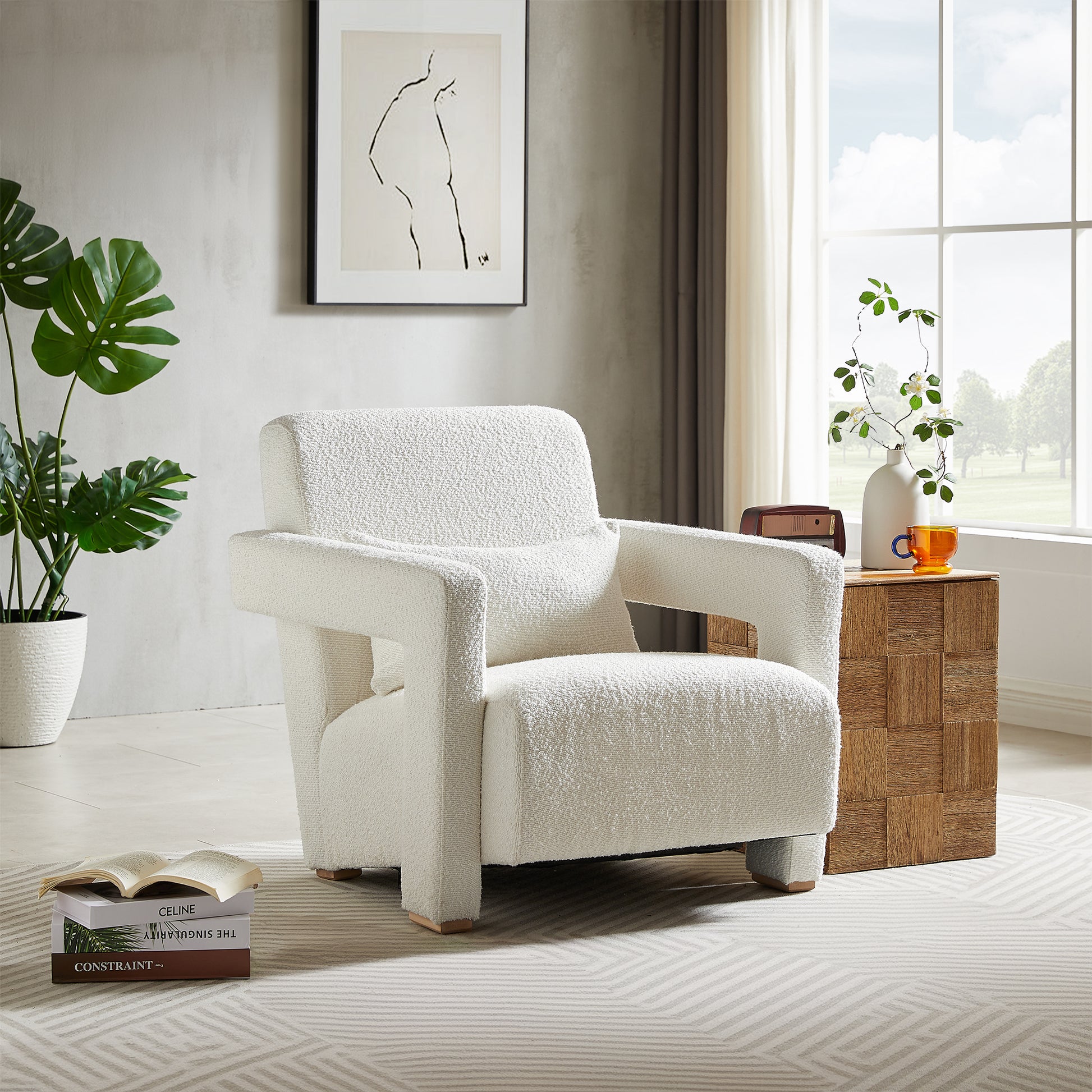 Cozy white boucl armchair with plush fabric and a modern silhouette