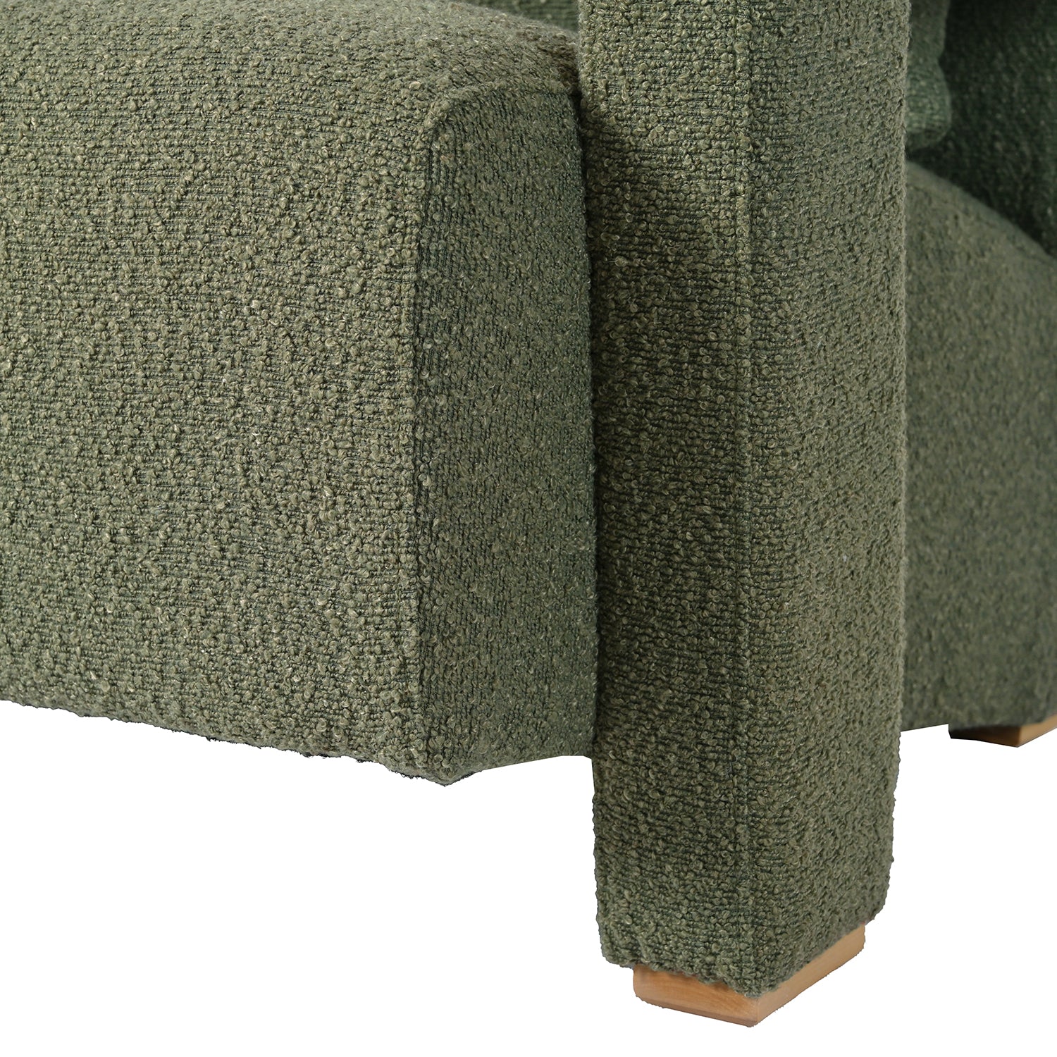 Textured green boucle sofa armrest with wooden feet