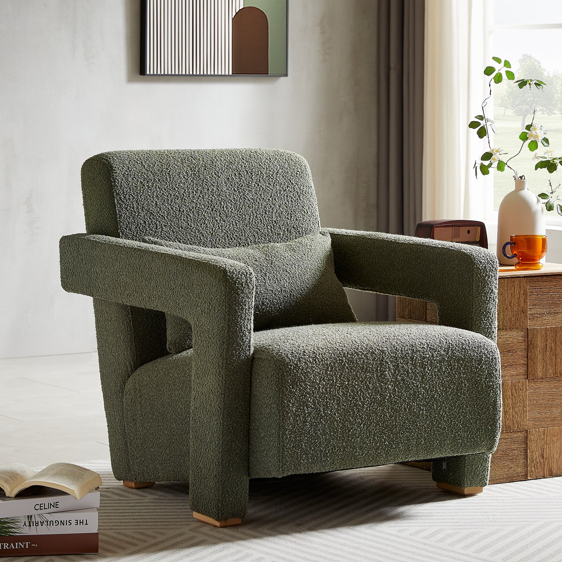 Green boucle armchair with plush cushions a modern statement piece for living rooms
