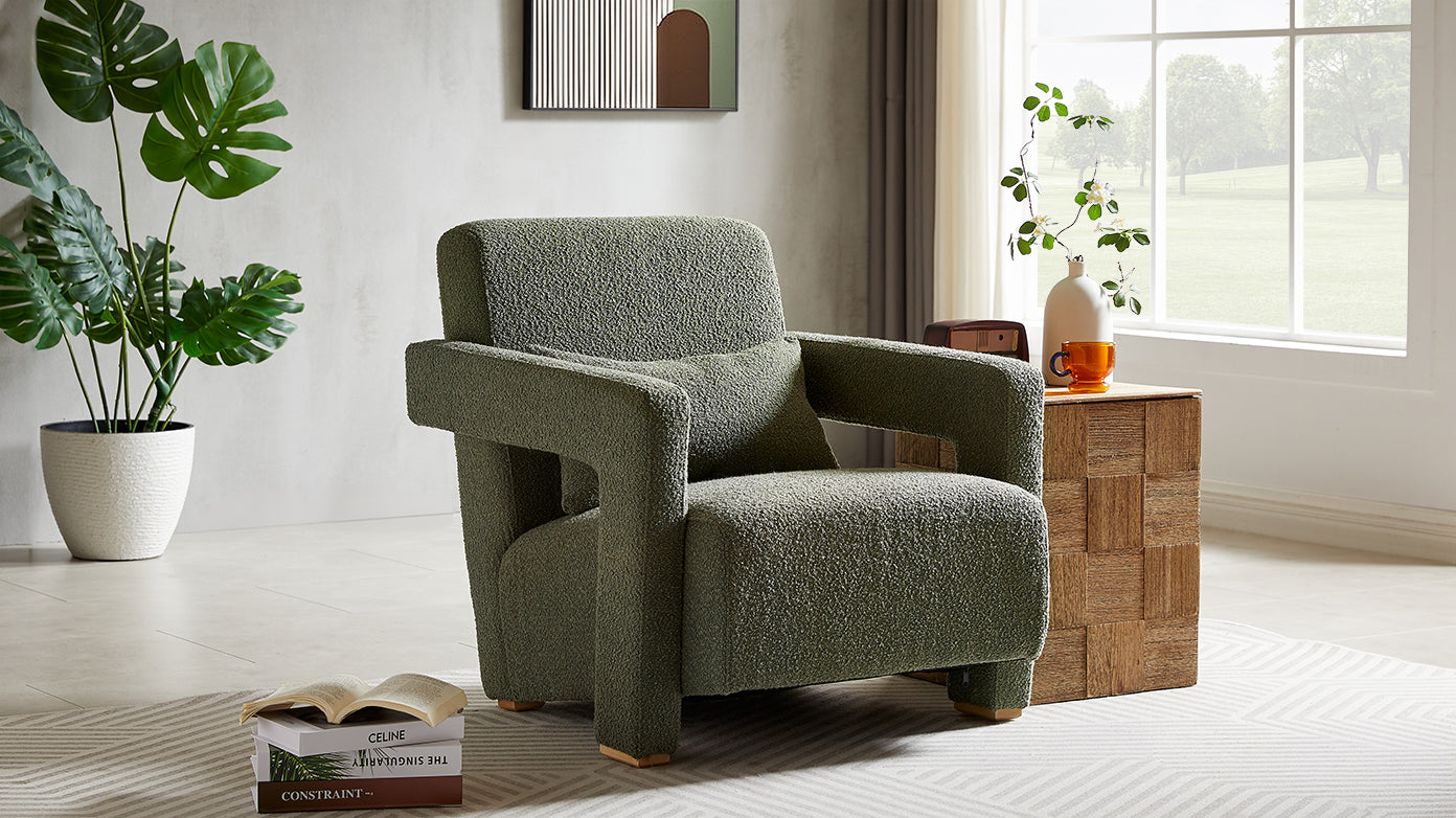 Textured green boucle armchair with a plush seat and armrests perfect for a cozy living room accent chair