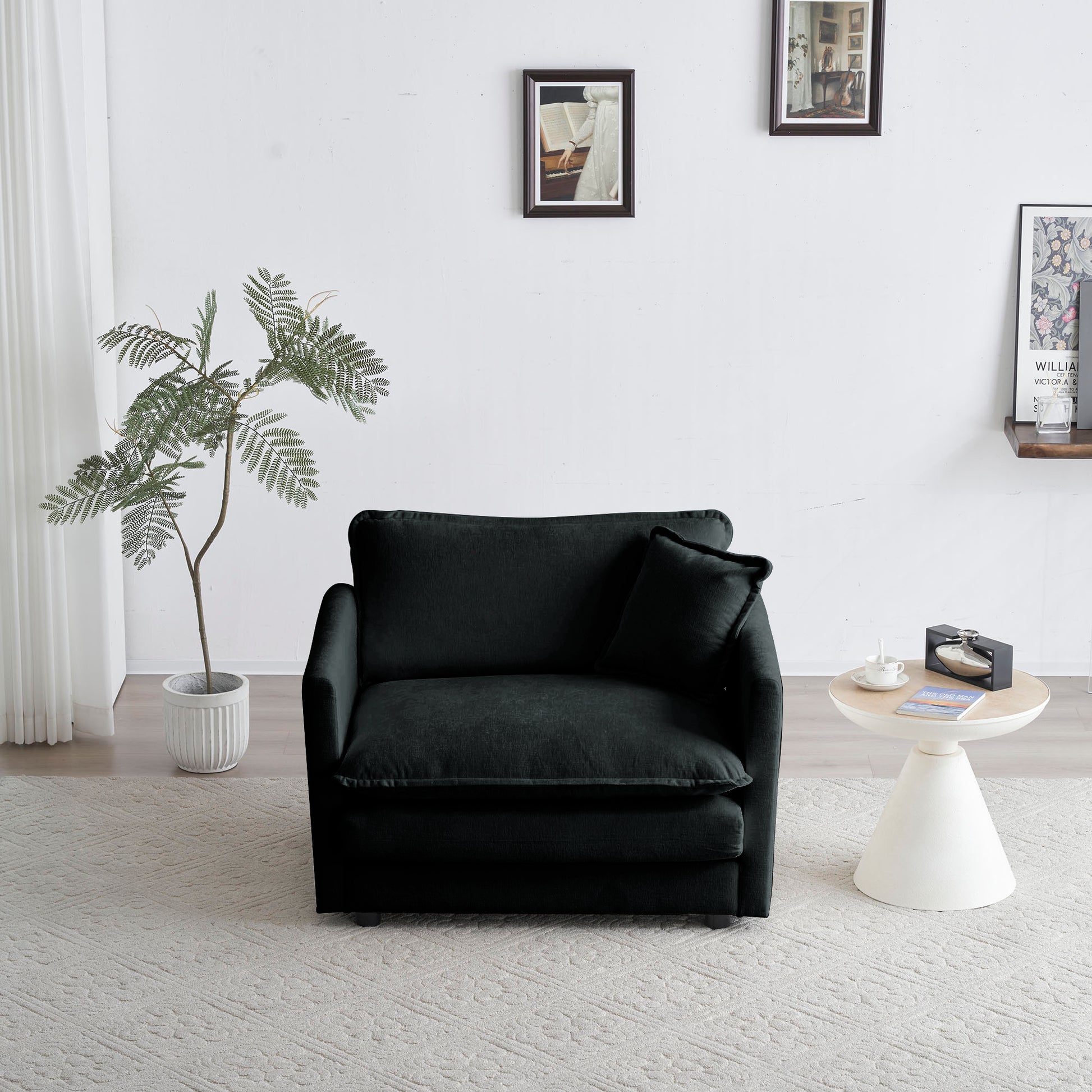 Plush dark charcoal velvet armchair with square armrests and lumbar pillow